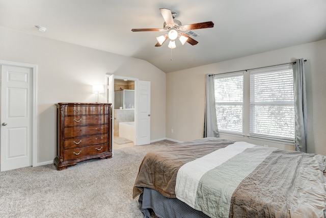 carpeted bedroom with connected bathroom, ceiling fan, and lofted ceiling