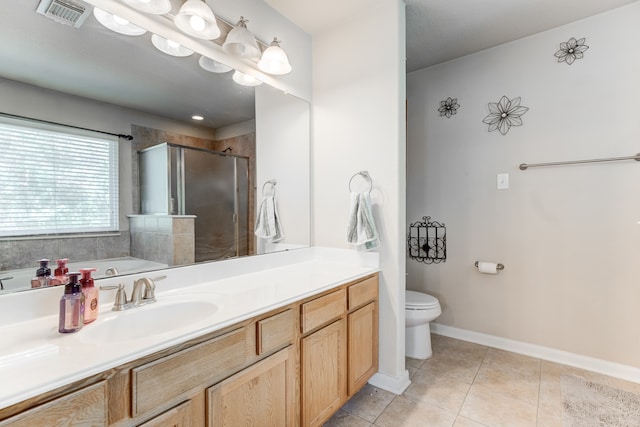 full bathroom with plus walk in shower, vanity, tile patterned floors, and toilet