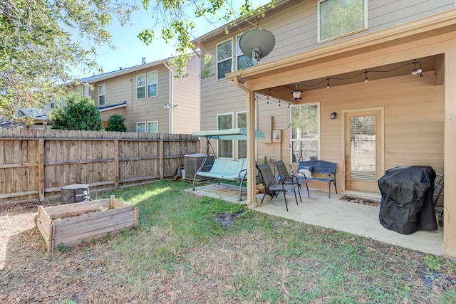 back of house featuring a patio area and central AC