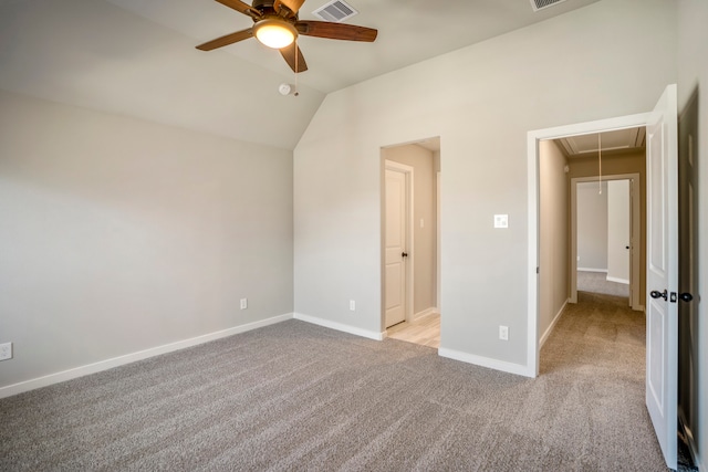 unfurnished bedroom with light carpet, ceiling fan, and lofted ceiling