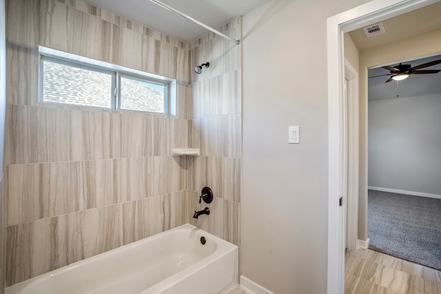 bathroom with tiled shower / bath and ceiling fan