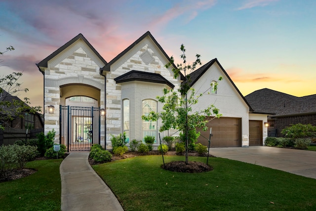 view of front of house with a lawn and a garage