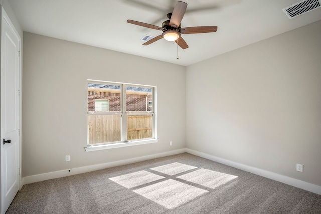 carpeted empty room with ceiling fan