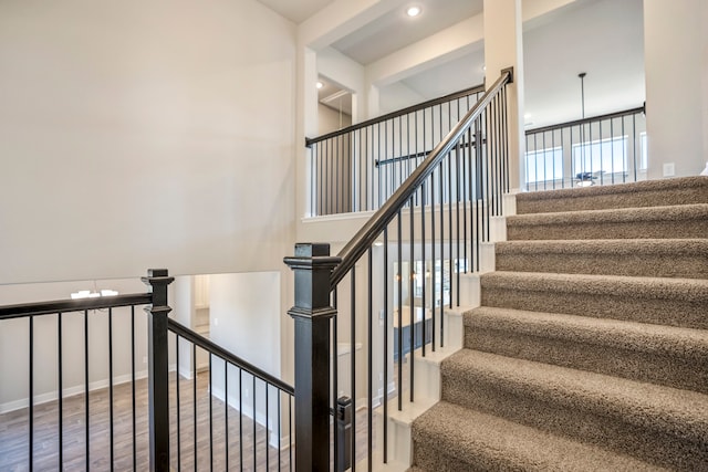 staircase featuring hardwood / wood-style floors