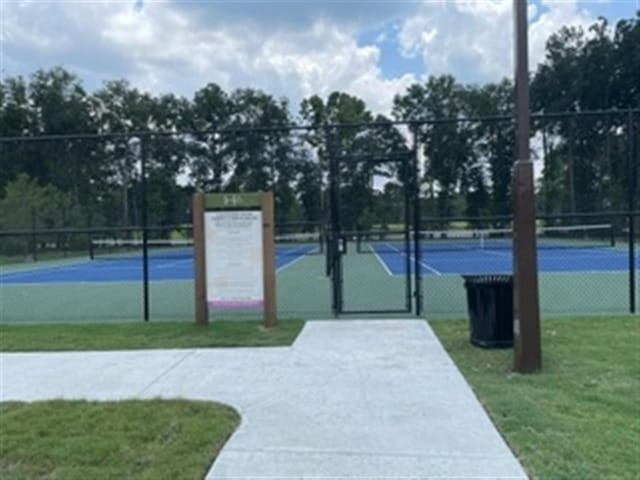 exterior space with tennis court