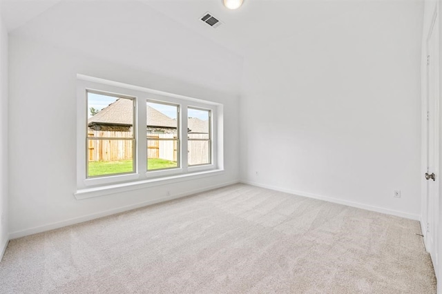 7427 Cattail Falls Ln, Porter, TX 77365 - carpeted empty room featuring baseboards and vaulted ceiling