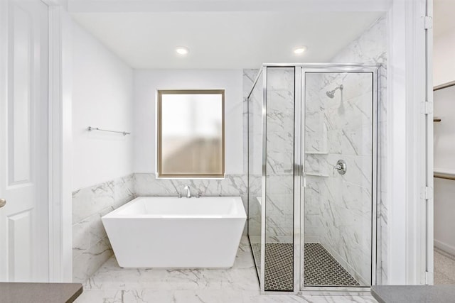 7427 Cattail Falls Ln, Porter, TX 77365 - bathroom with a marble finish shower, a soaking tub, tile walls, marble finish floors, and recessed lighting