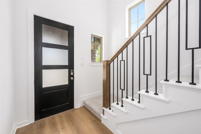 7427 Cattail Falls Ln, Porter, TX 77365 - entrance foyer with wood finished floors, stairs, and baseboards