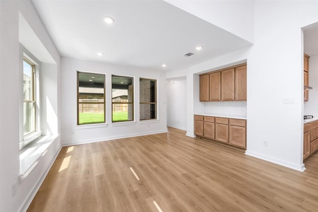 7427 Cattail Falls Ln, Porter, TX 77365 - unfurnished living room featuring light wood-style floors, recessed lighting, and baseboards