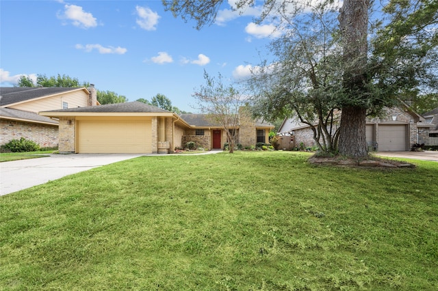 view of front of property featuring a front lawn and a garage