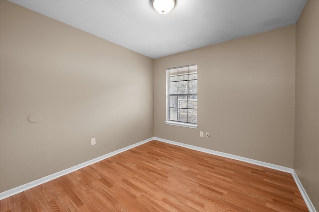 spare room with light wood-type flooring