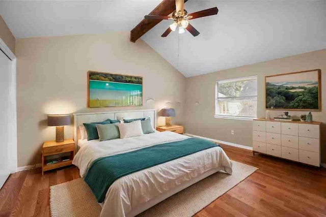 bedroom featuring hardwood / wood-style flooring, ceiling fan, and lofted ceiling with beams