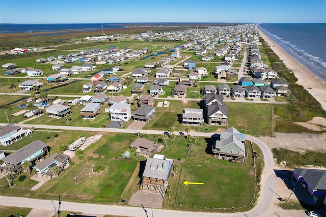 bird's eye view featuring a beach view and a water view