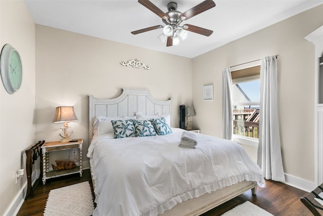 bedroom featuring ceiling fan and dark hardwood / wood-style flooring