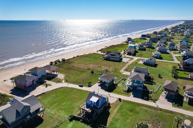 aerial view with a water view and a view of the beach