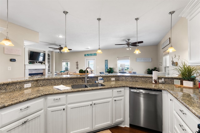 kitchen featuring ceiling fan, sink, decorative light fixtures, dishwasher, and white cabinetry