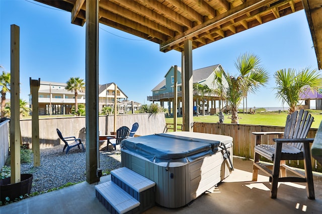 view of patio / terrace with a hot tub