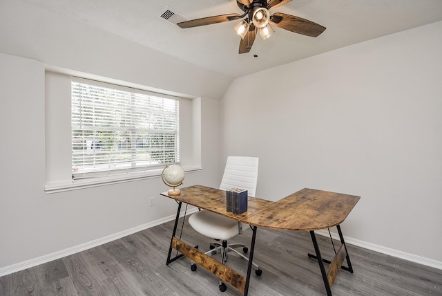 home office with ceiling fan, dark hardwood / wood-style flooring, and vaulted ceiling