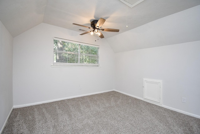 additional living space with carpet, vaulted ceiling, and ceiling fan