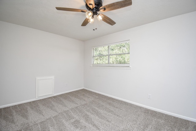 unfurnished room featuring ceiling fan and carpet floors