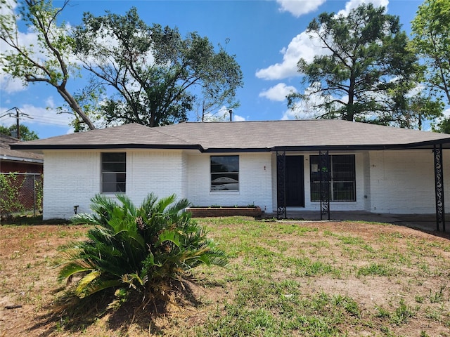 ranch-style house with a front yard