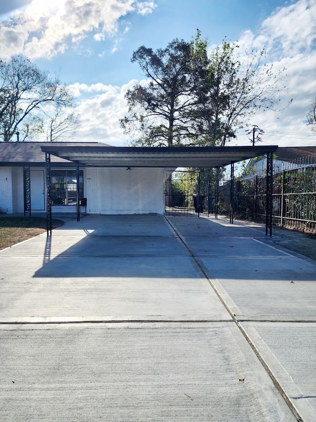 view of vehicle parking with a carport