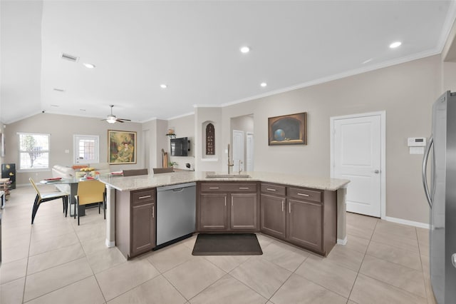 kitchen with stainless steel appliances, ornamental molding, light stone countertops, and sink