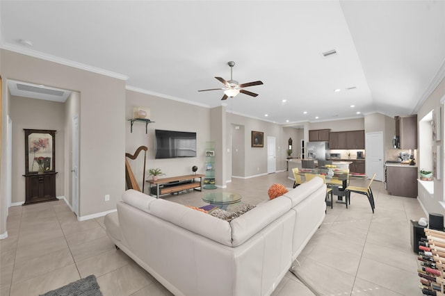 tiled living room with crown molding, vaulted ceiling, and ceiling fan