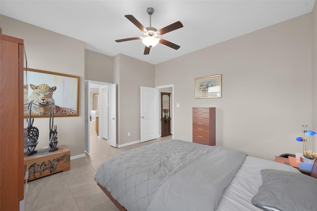 tiled bedroom featuring ceiling fan