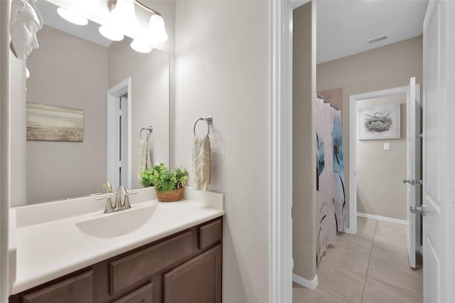 bathroom with vanity and tile patterned floors