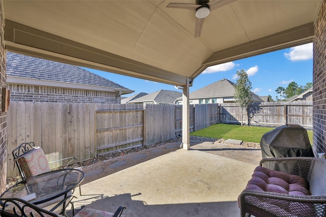 view of patio featuring ceiling fan