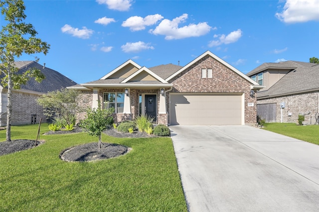 craftsman-style house featuring a front lawn and a garage