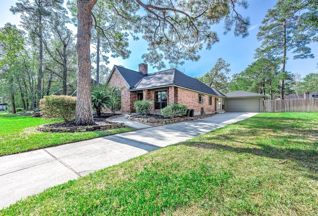 view of front of house featuring a garage and a front yard