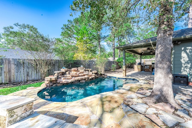 view of pool with ceiling fan and a patio