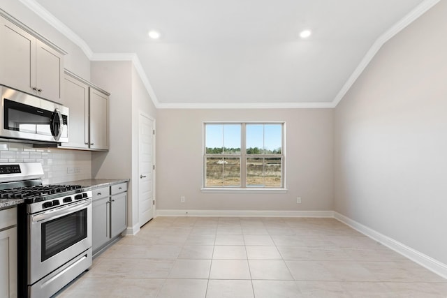 kitchen featuring gray cabinetry, backsplash, ornamental molding, light stone counters, and stainless steel appliances