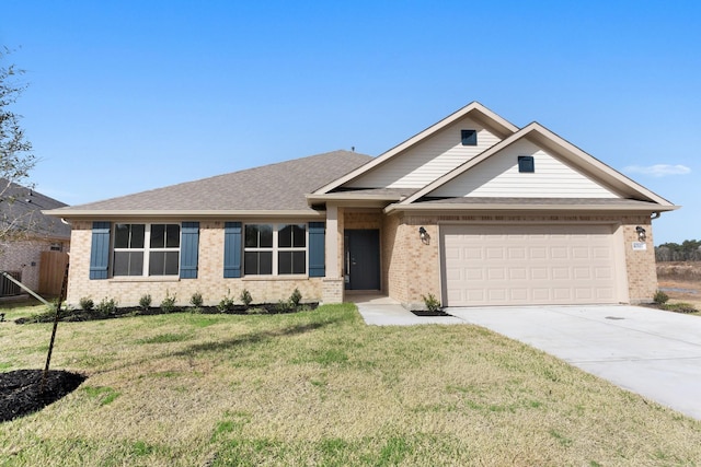 view of front of property with a garage and a front lawn