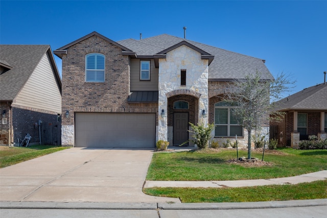 view of front of home featuring a garage and a front lawn