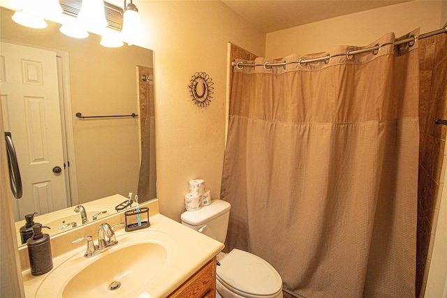 bathroom with a shower with curtain, vanity, and toilet