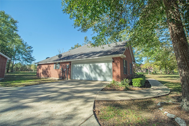 view of side of property featuring a garage