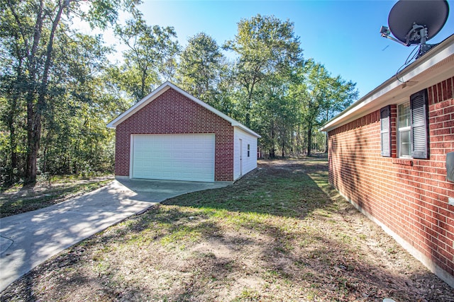 exterior space featuring a garage and an outdoor structure