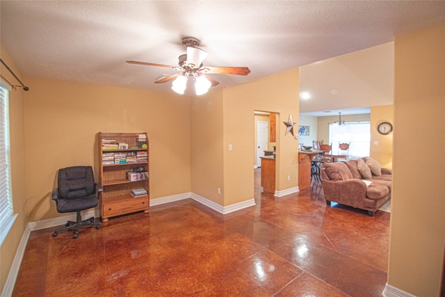 office with a textured ceiling, ceiling fan, and vaulted ceiling