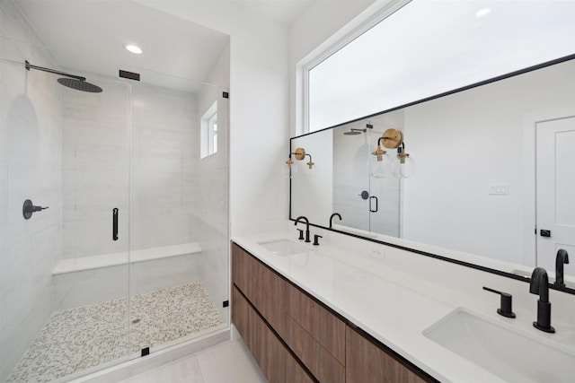 bathroom with vanity, tile patterned floors, and a shower with shower door