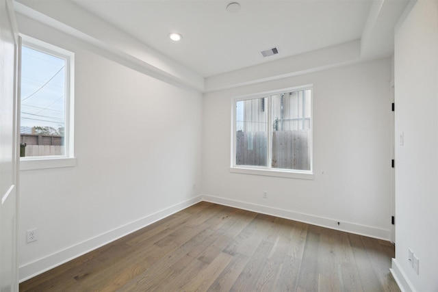 unfurnished room featuring hardwood / wood-style floors