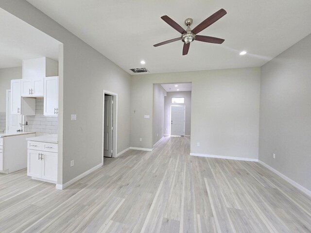 5251 Dewberry St, Houston, TX 77021 - unfurnished living room featuring ceiling fan, light wood finished floors, recessed lighting, and baseboards