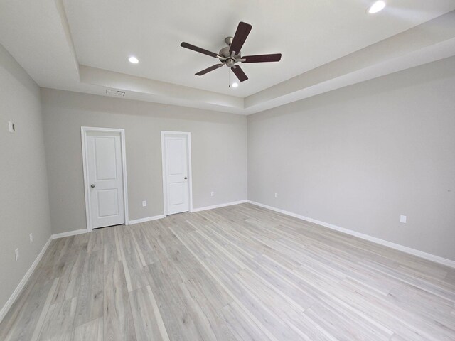 5251 Dewberry St, Houston, TX 77021 - unfurnished room featuring ceiling fan, light wood-style flooring, recessed lighting, a raised ceiling, and baseboards