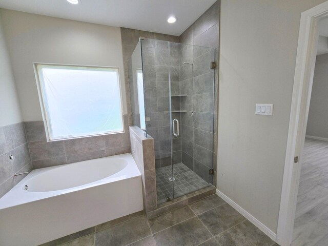 5251 Dewberry St, Houston, TX 77021 - full bathroom featuring a garden tub, a stall shower, baseboards, recessed lighting, and tile patterned floors