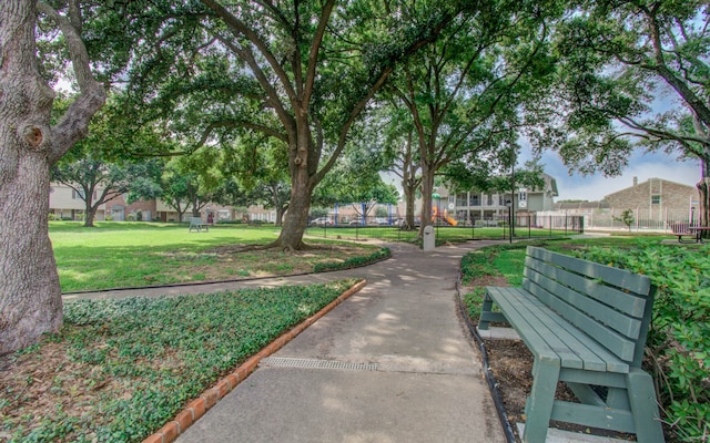 view of property's community featuring a yard