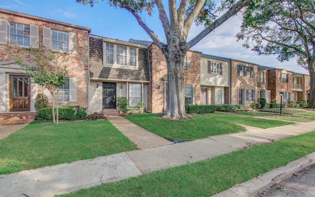 view of property featuring a front yard