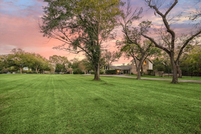 view of property's community featuring a lawn