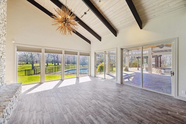 unfurnished sunroom with wooden ceiling and vaulted ceiling with beams